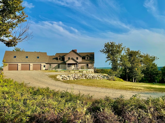 view of front of property featuring a garage and a front yard