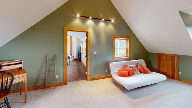 living area with lofted ceiling and carpet flooring