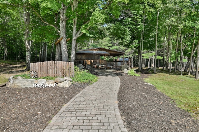 view of property's community featuring fence