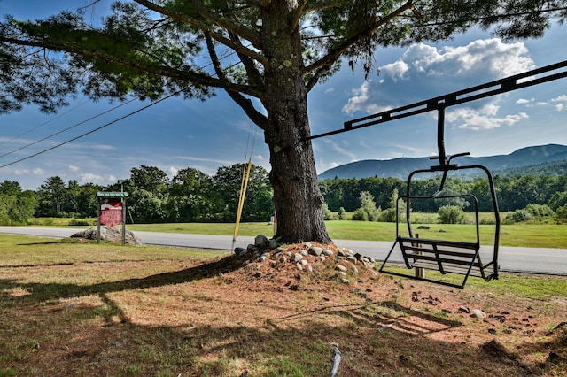 view of yard featuring community basketball court and a mountain view