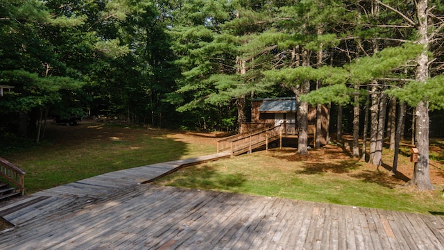 wooden terrace featuring stairway and a yard