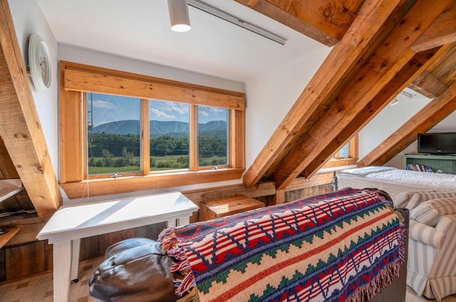 bedroom featuring a mountain view