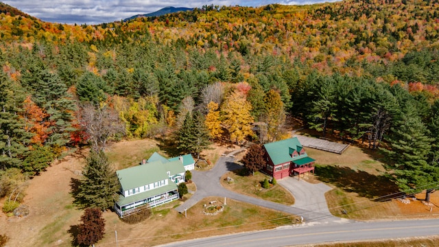 bird's eye view featuring a mountain view and a view of trees