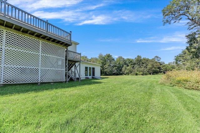 view of yard featuring a wooden deck