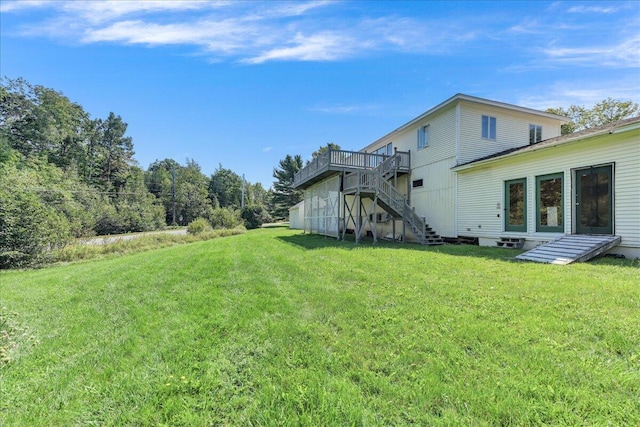 view of yard featuring a wooden deck