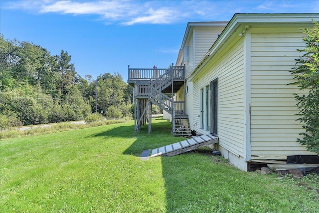 view of yard with a wooden deck