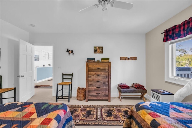 interior space with ceiling fan