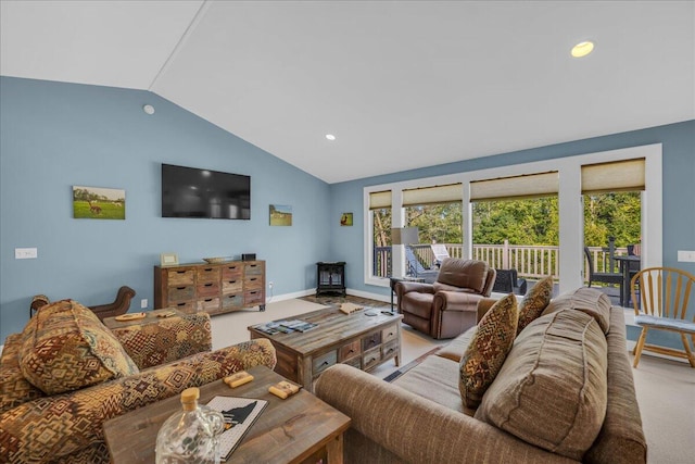 living room with lofted ceiling and light colored carpet