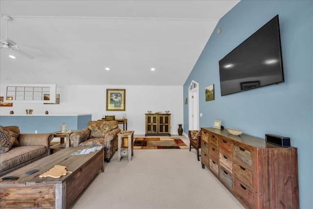 carpeted living room with lofted ceiling and ceiling fan