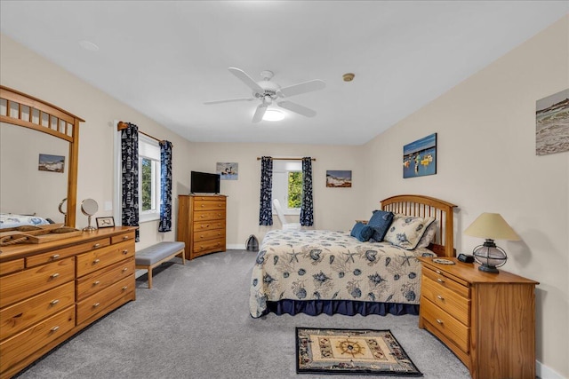 bedroom featuring light carpet and ceiling fan