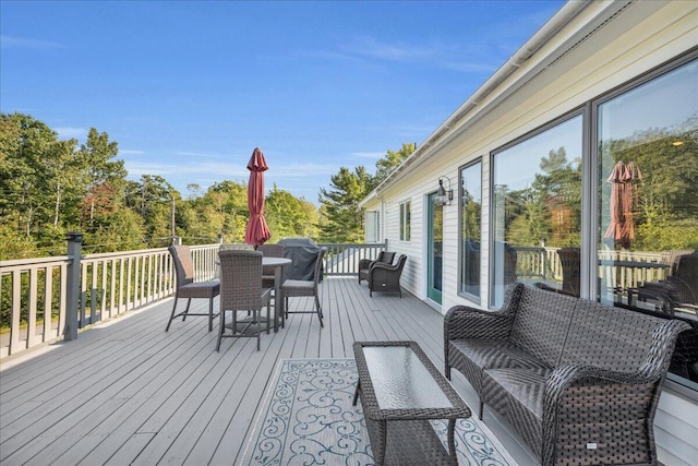 wooden deck featuring an outdoor hangout area