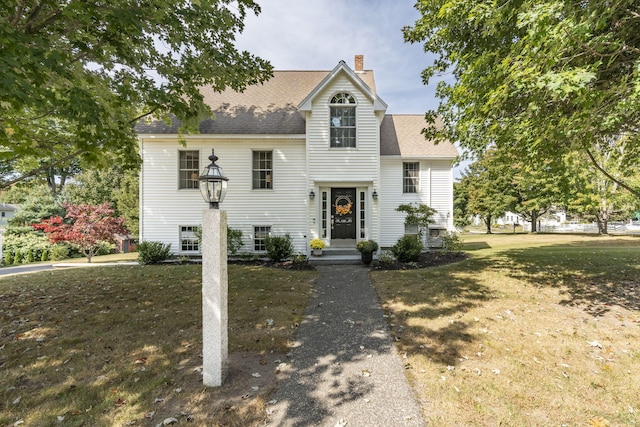 view of front of home with a front lawn