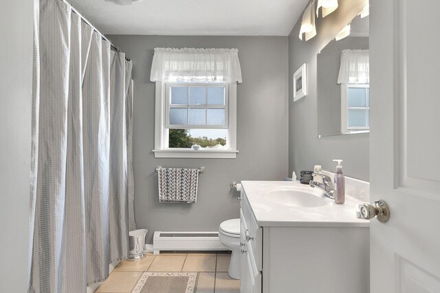 bathroom featuring a baseboard heating unit, tile patterned flooring, a shower with curtain, vanity, and toilet