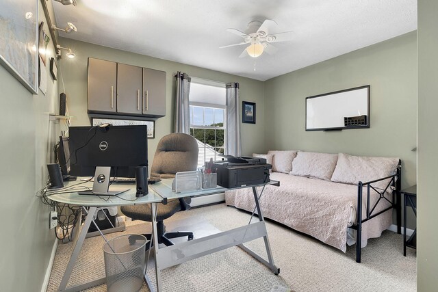 bedroom with ceiling fan and light colored carpet