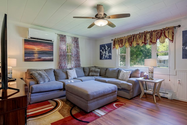 living room with hardwood / wood-style floors, a wall mounted AC, ornamental molding, a baseboard radiator, and ceiling fan