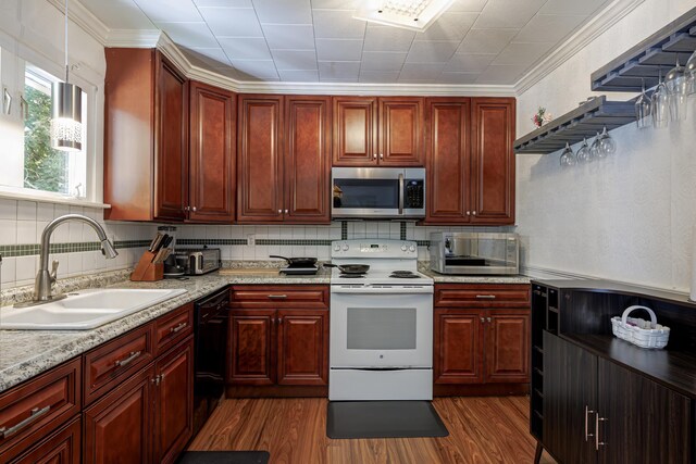 kitchen featuring ornamental molding, electric range, sink, and dark hardwood / wood-style flooring