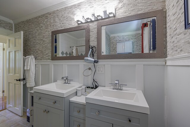 bathroom featuring tile patterned flooring, vanity, and ornamental molding