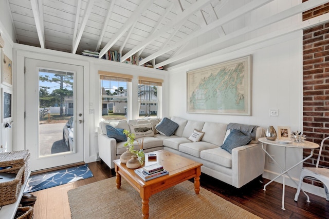 living room featuring dark wood-type flooring, beamed ceiling, and wooden ceiling