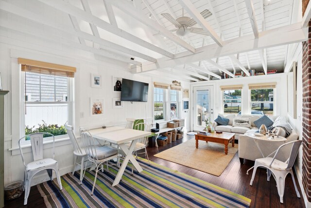 living room featuring ceiling fan, beamed ceiling, and hardwood / wood-style flooring