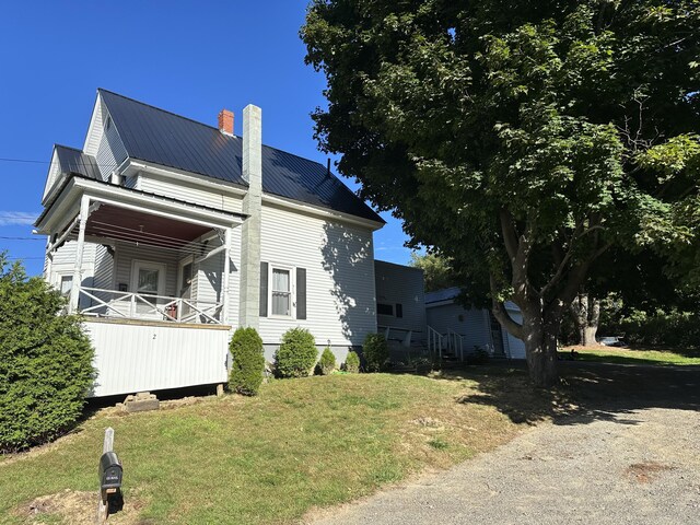 view of home's exterior with a lawn