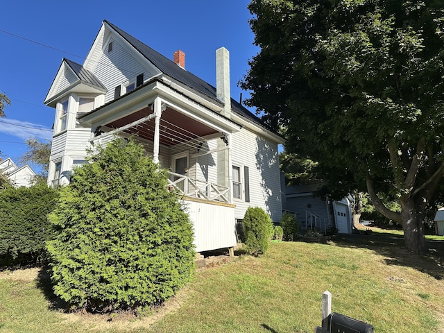 view of property exterior featuring a yard