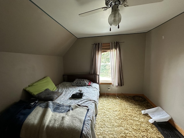 carpeted bedroom with lofted ceiling and ceiling fan