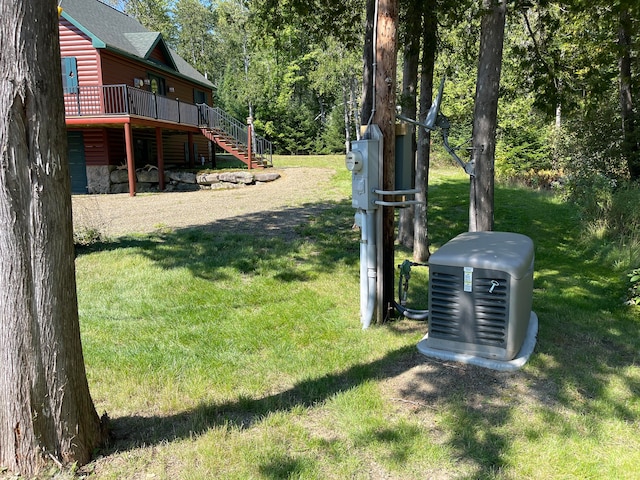 view of yard featuring stairs and a deck