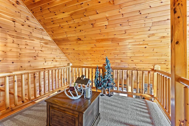 interior space featuring wooden walls, carpet, wood ceiling, and vaulted ceiling