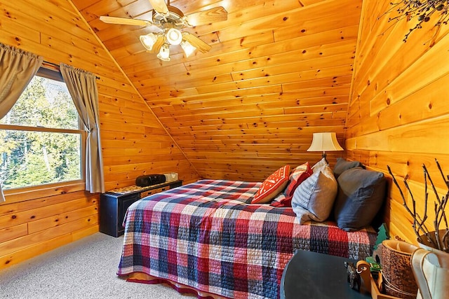 bedroom with ceiling fan, wooden ceiling, vaulted ceiling, wooden walls, and carpet