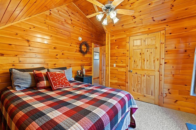 carpeted bedroom with wood walls, ceiling fan, and lofted ceiling