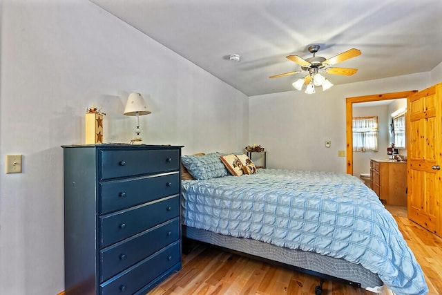 bedroom with light hardwood / wood-style floors and ceiling fan