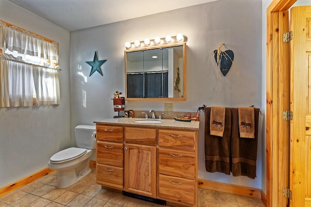 bathroom with tile patterned floors, vanity, toilet, and a shower with curtain