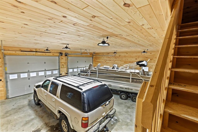 garage featuring wooden walls and wooden ceiling