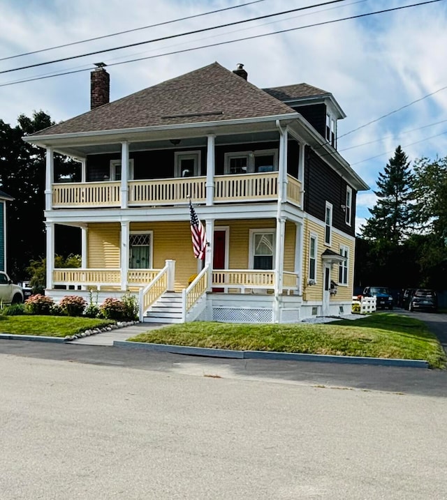 view of front of home with a balcony and a porch