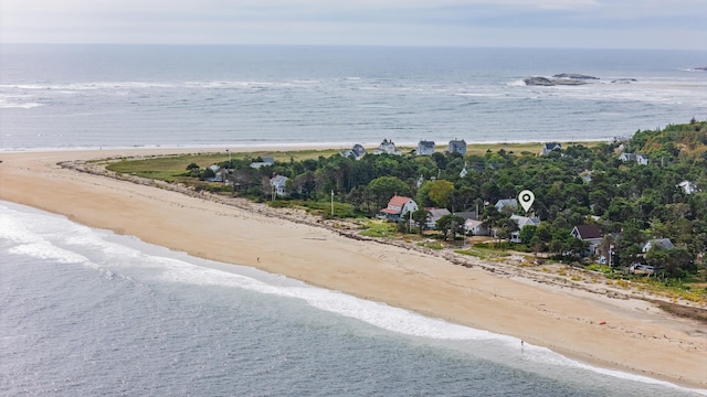 birds eye view of property with a view of the beach and a water view