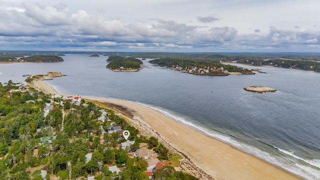 bird's eye view featuring a beach view and a water view