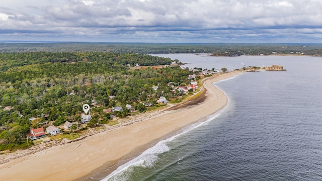 bird's eye view with a water view and a beach view