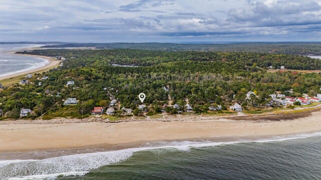 bird's eye view with a water view and a beach view