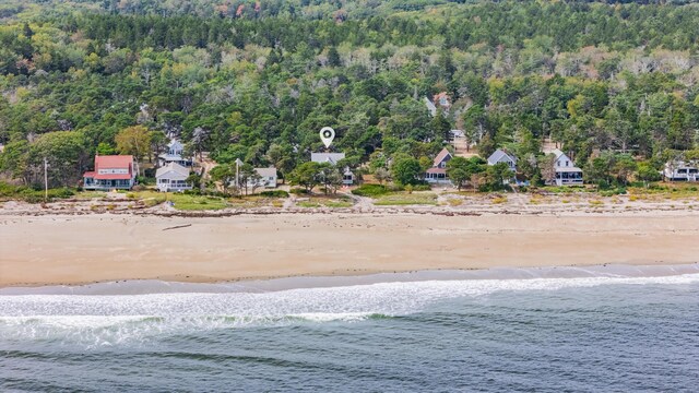 bird's eye view with a water view and a view of the beach