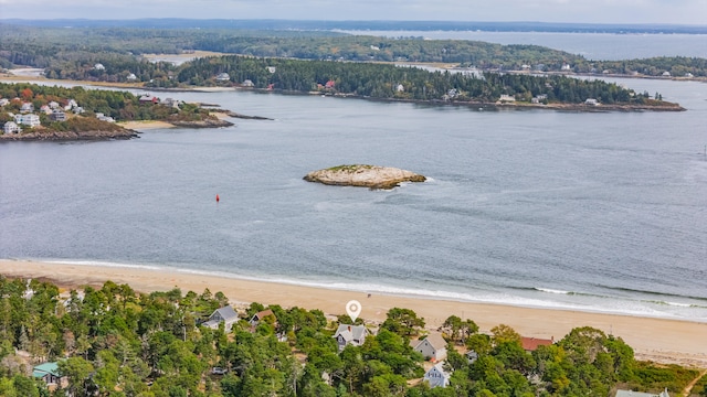 birds eye view of property featuring a view of the beach and a water view