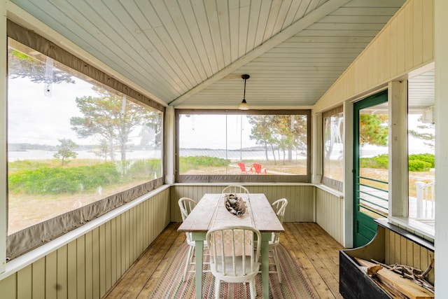 sunroom with wooden ceiling and vaulted ceiling