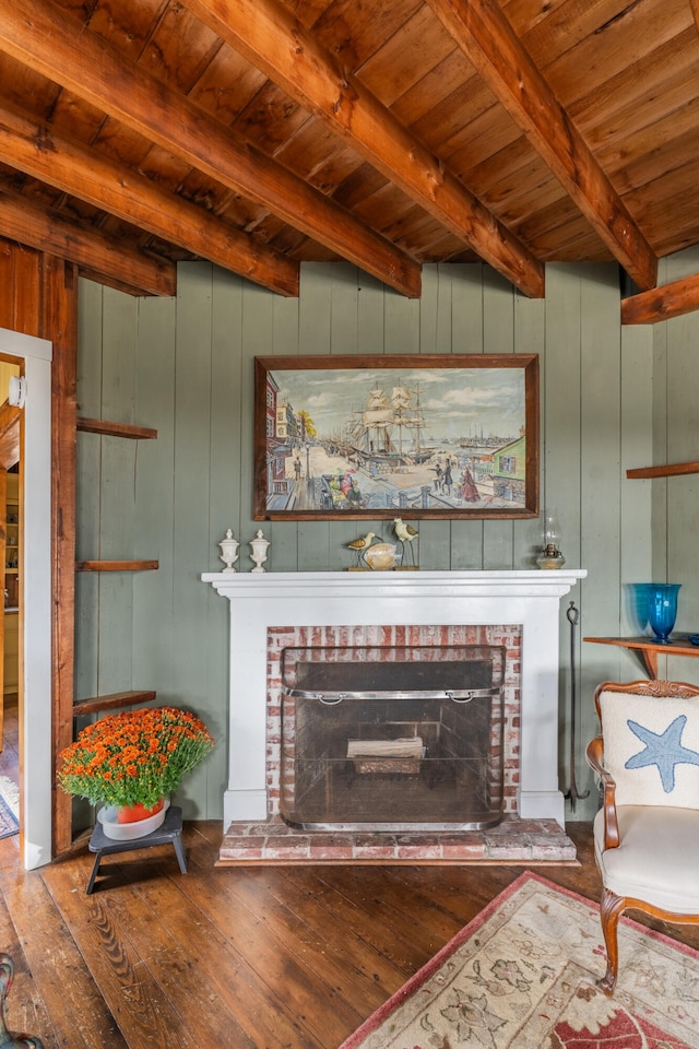 living room featuring a fireplace, wood walls, wooden ceiling, beam ceiling, and hardwood / wood-style flooring