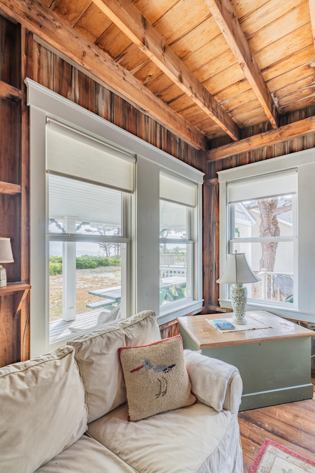 living room with wood ceiling, wood-type flooring, and beamed ceiling