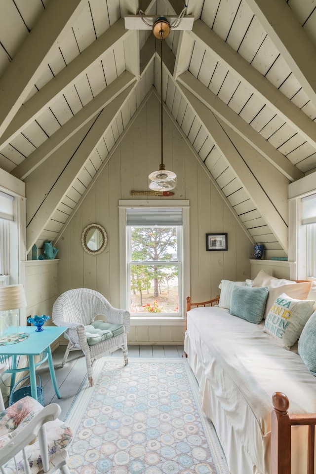 interior space featuring vaulted ceiling with beams, wood ceiling, and wooden walls