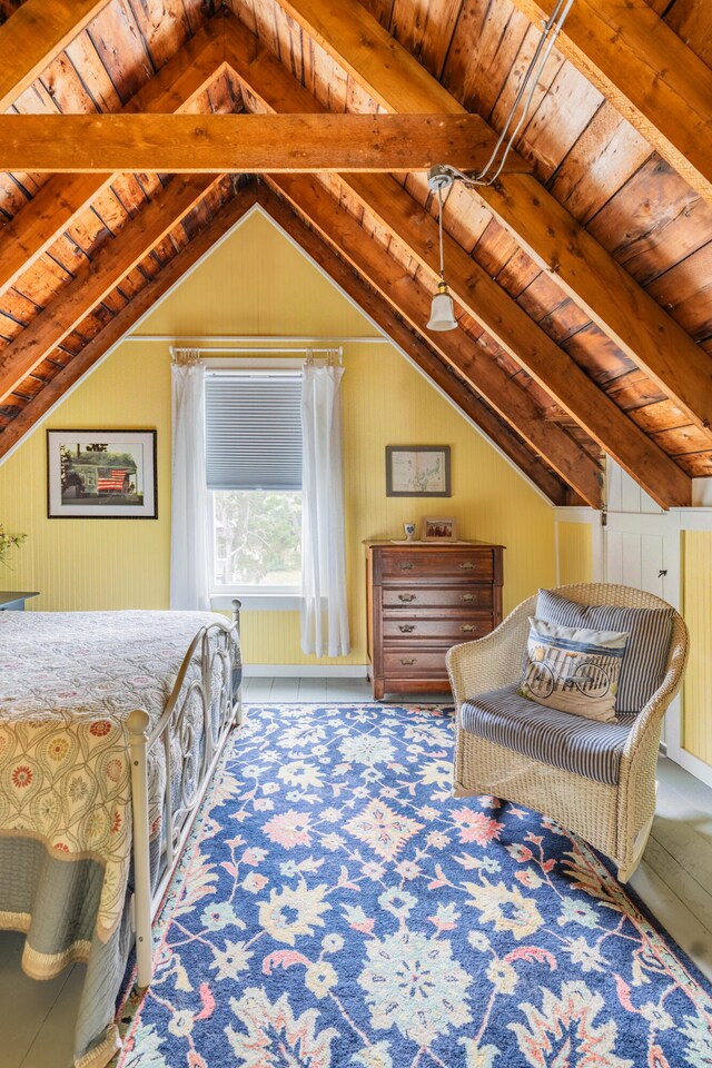 bedroom featuring vaulted ceiling with beams, wooden walls, and wooden ceiling