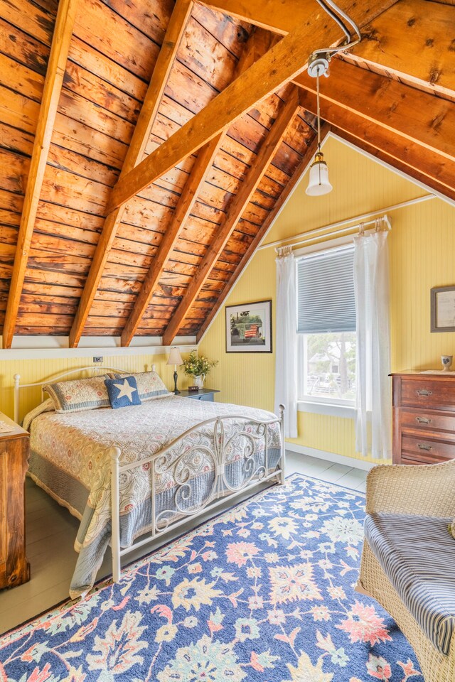 bedroom featuring vaulted ceiling with beams and wooden ceiling