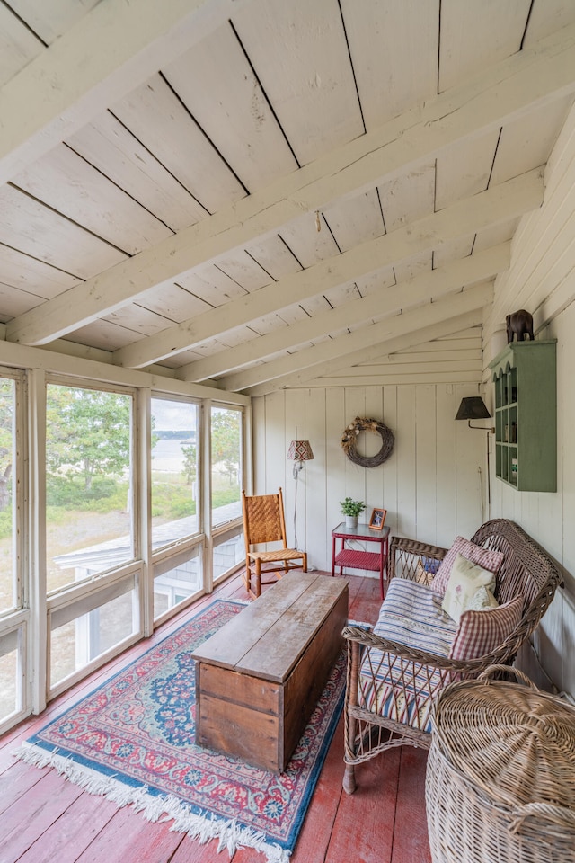 sunroom with wooden ceiling and vaulted ceiling with beams