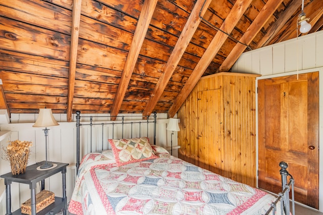 bedroom featuring lofted ceiling and wood walls