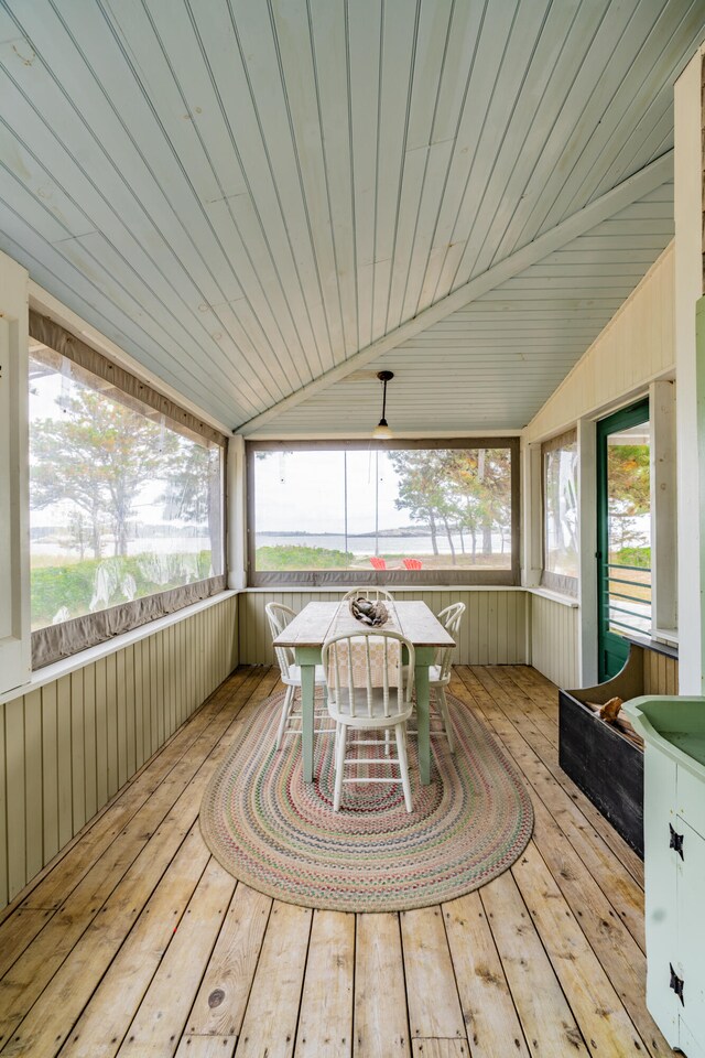 unfurnished sunroom with wood ceiling and vaulted ceiling