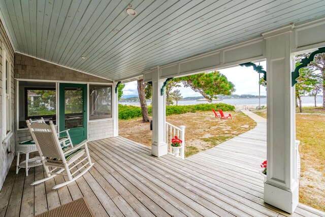 wooden deck with a water view